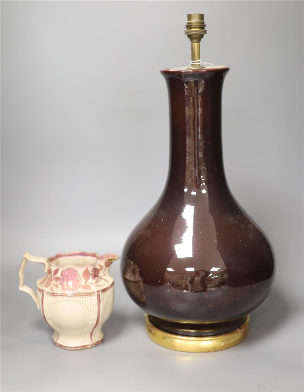 A sang de boeuf lamp base, 41cm high including stand and a pink lustre jug